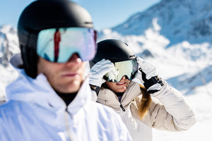 Snowboarder wearing a Coal toque or beanie. Skier launching off a rock with Line skis. Mad Dog's Ski and Board carries a wide variety of accessories including toques, gloves, helmets, goggles, and belts!
