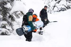 Capita rider launching between a tree, riding a Capita snowboard. Mad Dog's Ski and Board carries a wide variety of snowboards and snowboard equipment and accessories!
